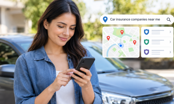 Car insurance research with a vehicle, smartphone, car keys and insurance documents near a local insurance office.